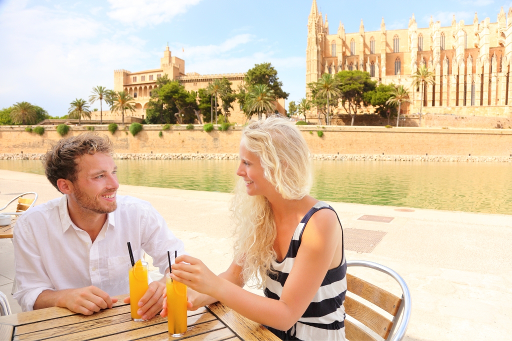 A couple chats in a cafe in Mallorca